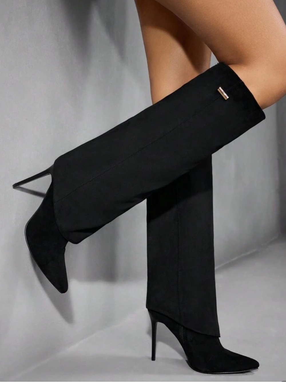 Black suede boots with pointed toe and stiletto heel